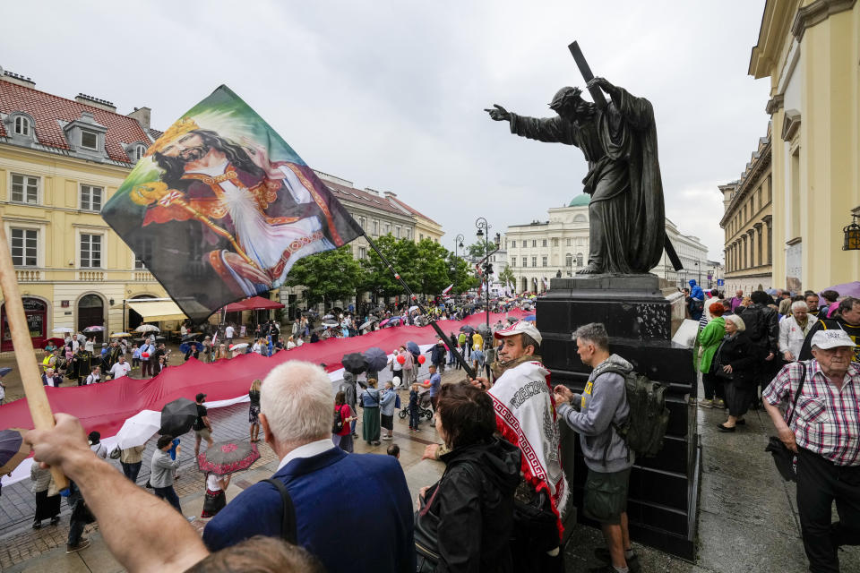 People take part in the March for Life and Family, an annual march against abortion and in support of conservative values, in Warsaw, Poland, on Sunday June 18, 2023. The march was held a day after the city's large Pride parade, and reflects a show for conservative Catholic values as the Pride parades have grown larger and more numerous.(AP Photo/Czarek Sokolowski)