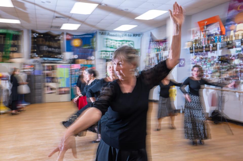 West Palm Beach resident Leslie Salmon flourishes with her hands while practicing flamenco.