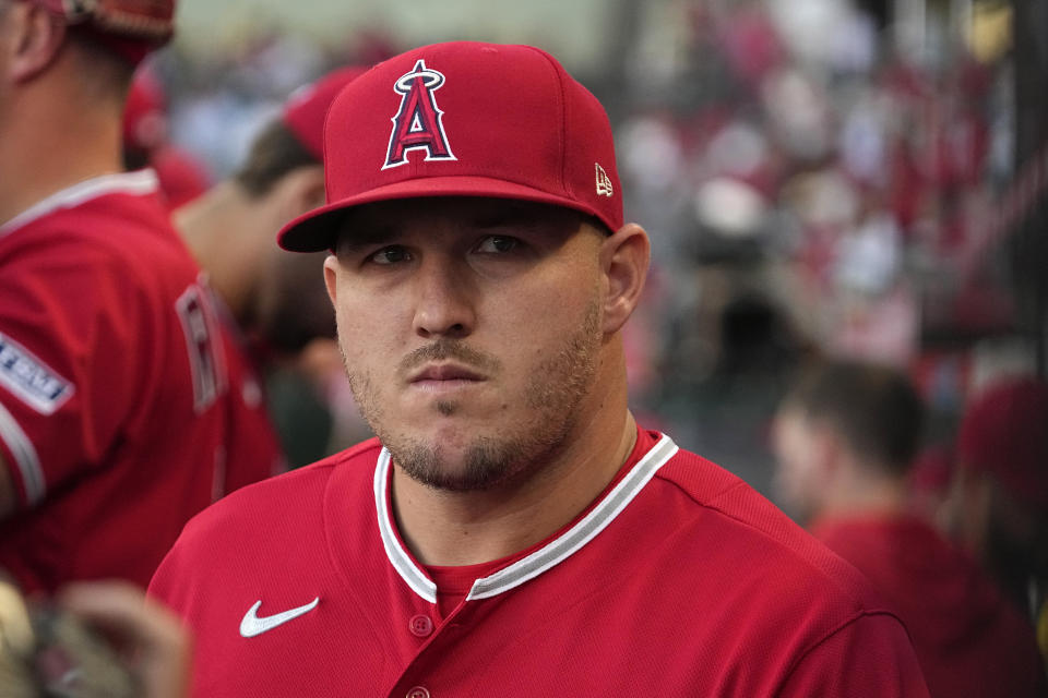 Los Angeles Angels' Mike Trout gets ready to head out to the field for the first inning of a baseball game against the Cincinnati Reds Tuesday, Aug. 22, 2023, in Anaheim, Calif. (AP Photo/Mark J. Terrill)