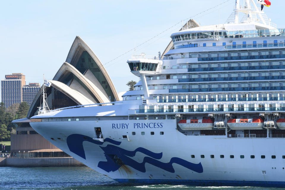 Ruby Princess belonging to cruise ship company Princess Cruises, passes by the Opera House.