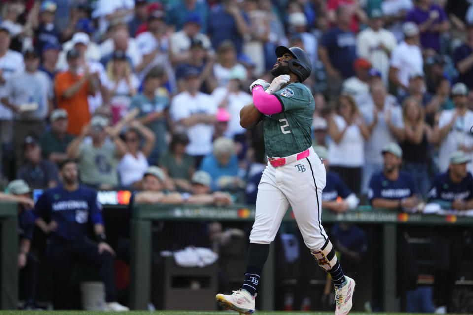 American League's Yandy Díaz, of the Tampa Bay Rays, celebrates his solo home run in the second inning during the MLB All-Star baseball game in Seattle, Tuesday, July 11, 2023. (AP Photo/Lindsey Wasson)