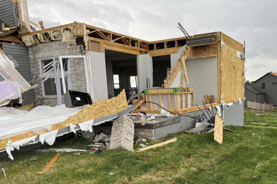 A destroyed house is seen northwest of Omaha, Neb., after storms swept through the area on Friday, April 26, 2024. (AP Photo/Margery A. Beck)