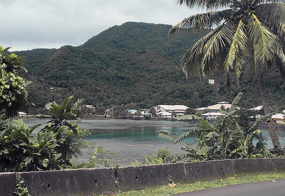 This Feb. 5, 2020 photo provided by Tisa Fa'amuli shows homes on a bay in the village of Alega on Tutuila, the largest island in the American Samoa archipelago. A U.S. judge recently sided with three American Samoans in Utah wanting to be recognized as citizens. The American Samoa government is expected to appeal, and has until Monday to do so. Many in the U.S. territory are perfectly happy being U.S. nationals who can't vote in most federal elections or run for office outside American Samoa. (Tisa Fa'amuli via AP)