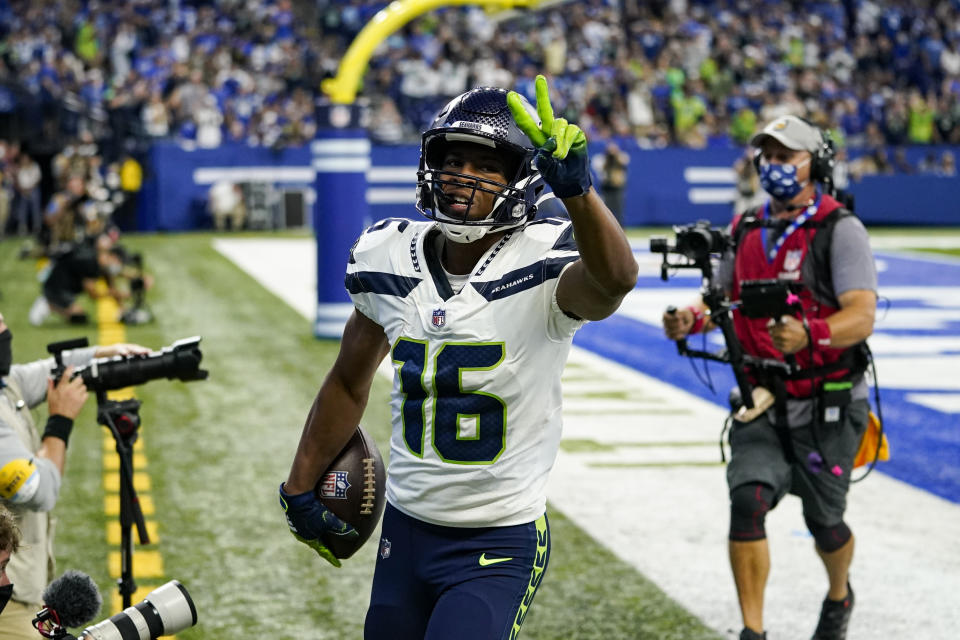 Seattle Seahawks wide receiver Tyler Lockett (16) celebrates after a touchdown against the Indianapolis Colts in the first half of an NFL football game in Indianapolis, Sunday, Sept. 12, 2021. (AP Photo/Charlie Neibergall)