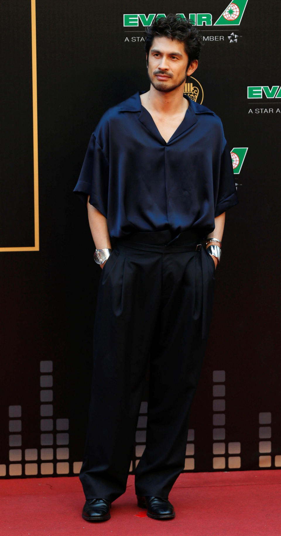 Japan’s singer Ken Hirai poses in a navy blue top and black pants. (Reuters/Tyrone Siu)