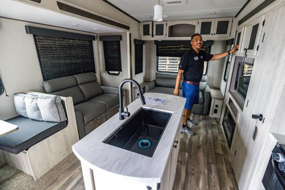 Sales Specialist Antoine Dulin gives a tour of the inside of a five-wheel RV for sale at United RV Center in Haltom City on Tuesday, Sept. 12, 2023.