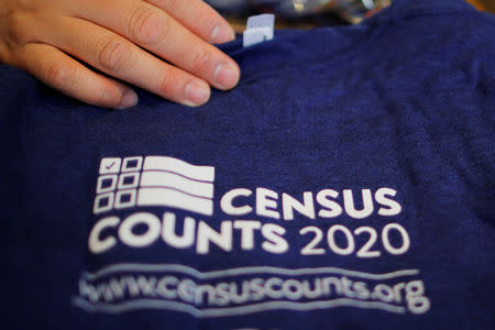 T-shirts are displayed at a community activists and local government leaders event to mark the one-year-out launch of the 2020 Census efforts in Boston, Massachusetts, U.S., April 1, 2019. REUTERS/Brian Snyder