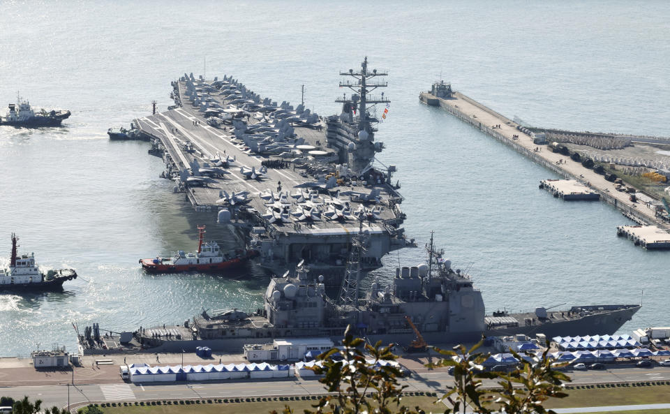 U.S. nuclear-powered aircraft carrier USS Ronald Reagan is escorted as it arrives in Busan, South Korea, Thursday, Oct. 12, 2023. (Kang Duck-chul/Yonhap via AP)