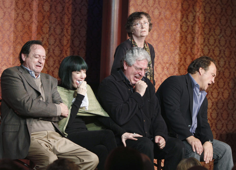 FILE - In this Dec. 12, 2009 file photo, actor and director Harold Ramis, center, along with actors from left, Joe Flaherty, Eugenie Ross-Leming, Judy Morgan, standing, and Jim Belushi break out in laughter as they perform a skit on stage to celebrate The Second City's 50th anniversary in Chicago. An attorney for Ramis said the actor died Monday morning, Feb. 24, 2014, from complications of autoimmune inflammatory disease at his home in Glencoe, Ill. He was 69. Ramis is best known for his roles in the comedies "Ghostbusters" and "Stripes." (AP Photo/Jim Prisching, File)