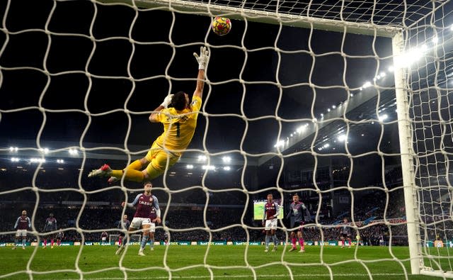 Emi Martinez makes a save from Harvey Barnes, not pictured