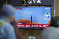 FILE - A TV screen showing a news program reporting about North Korea's missile launch with file footage, is seen at the Seoul Railway Station in Seoul, South Korea on Oct. 4, 2022. (AP Photo/Lee Jin-man, File)