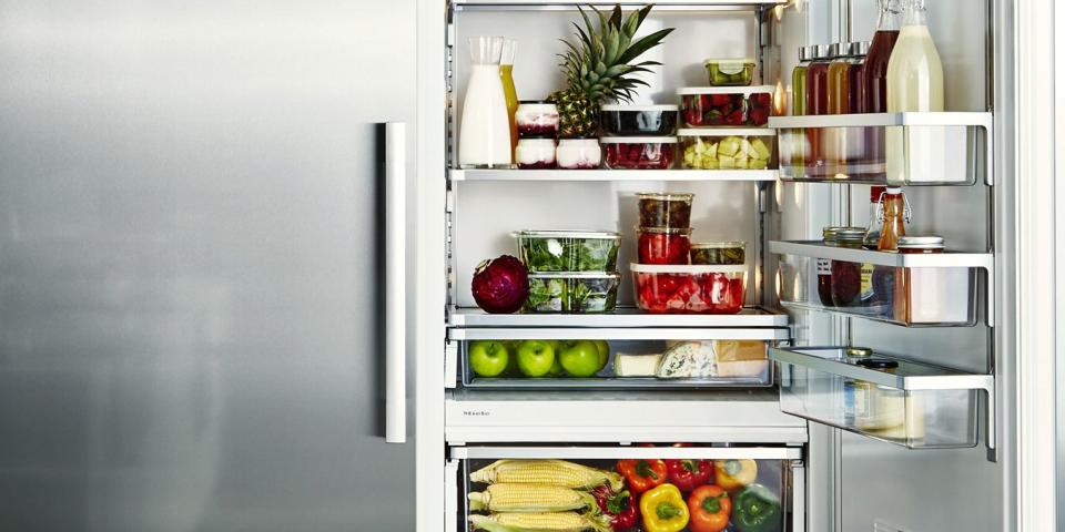 <p>It's mesmerizing to look at well-organized, color-coordinated refrigerator. (Try not to get lost in the perfectly placed peppers above.) But actually, an organized fridge also saves time and money. If you know exactly what's inside, <a rel="nofollow noopener" href="https://www.prevention.com/food-nutrition/g20465954/desperate-grocery-shopping-dinner-ideas/" target="_blank" data-ylk="slk:grocery shopping;elm:context_link;itc:0;sec:content-canvas" class="link ">grocery shopping</a> and mealtimes become way more efficient, with less food waste and unpleasant smells. </p><p>To get started, <em>Good Housekeeping's </em>Culinary Director <a rel="nofollow noopener" href="https://www.goodhousekeeping.com/author/11312/susan-westmoreland/" target="_blank" data-ylk="slk:Susan Westmoreland;elm:context_link;itc:0;sec:content-canvas" class="link ">Susan Westmoreland</a> recommends prioritizing the foods that people reach for most. From there, categorize the items into groups and place them in <a rel="nofollow noopener" href="https://www.goodhousekeeping.com/cooking-tools/food-storage-container-reviews/g2215/food-storage-containers/" target="_blank" data-ylk="slk:clear containers;elm:context_link;itc:0;sec:content-canvas" class="link ">clear containers</a> (key word: clear) for a more uniform look. The rest is up you: Stock up on different storage solutions to help combat rolling soda cans, overloaded snack drawers, and your growing wine stash. </p><p>When placing items on shelves, consider what makes most sense for you - and for the food itself. Most people keep milk on the top shelf or in the door <em>but</em> it should go on the back of the bottom shelf where it's coldest. <a rel="nofollow noopener" href="https://www.goodhousekeeping.com/food-recipes/easy/g428/easy-egg-recipes/" target="_blank" data-ylk="slk:Same goes for eggs:;elm:context_link;itc:0;sec:content-canvas" class="link ">Same goes for eggs:</a> Store eggs in their original cartons on middle or top shelves where temperatures are more consistent. Reserve the fridge door for condiments, butters, soft cheeses, and processed juices. <br></p><p>If you have <a rel="nofollow noopener" href="https://www.goodhousekeeping.com/home/organizing/tips/g725/back-to-school-kitchen-prep/" target="_blank" data-ylk="slk:young children;elm:context_link;itc:0;sec:content-canvas" class="link ">young children</a>, stick their go-to snacks at eye level so they can easily grab them without making a mess. You can reserve a special bin for each kid or throw all the snacks in one spot for people to pick from because, well, sharing is caring. </p><p>When you buy something new - a fresh gallon of milk, for example - rotate the older items to the front so that they can be used before the expiration date. Keep an eye – not just a nose - on leftovers: Westmoreland recommends tossing fish after one to two days, meat after two to three days, and veggies or grains after five to seven days. <br></p>