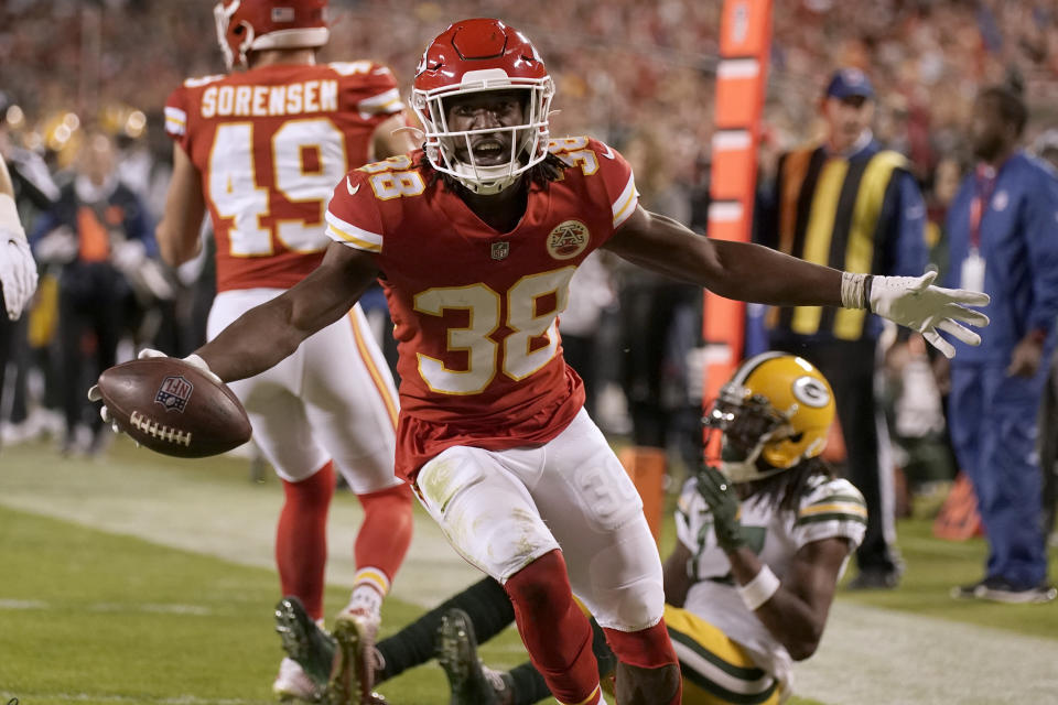 Kansas City Chiefs cornerback L'Jarius Sneed (38) celebrates after intercepting a pass intended for Green Bay Packers wide receiver Davante Adams, right, during the second half of an NFL football game Sunday, Nov. 7, 2021, in Kansas City, Mo. (AP Photo/Charlie Riedel)