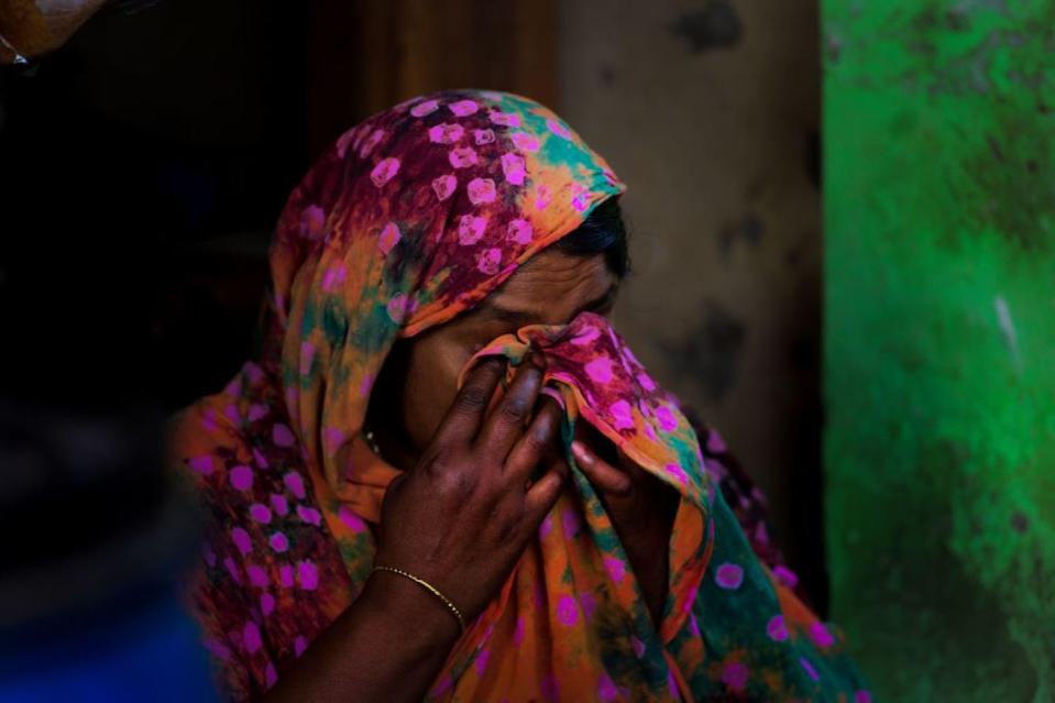 Nilufer Begum, an injured garment worker who survived the Rana Plaza disaster, during a 2018 interview with AFP in her small tea stall. <a href="https://www.gettyimages.com/detail/news-photo/in-this-photograph-taken-on-april-17-2018-nilufer-begum-an-news-photo/949797208?adppopup=true" rel="nofollow noopener" target="_blank" data-ylk="slk:Munir Uz Zaman/AFP via Getty Images;elm:context_link;itc:0;sec:content-canvas" class="link ">Munir Uz Zaman/AFP via Getty Images</a>