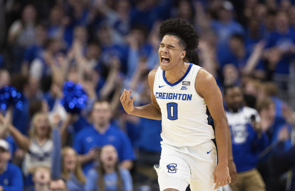 Creighton's Jasen Green (0) celebrates a 3-point basket against UConn during the first half of an NCAA college basketball game Tuesday, Feb. 20, 2024, in Omaha, Neb. (AP Photo/Rebecca S. Gratz)