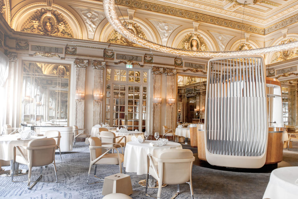 <p>With a menu created by famed Alain Ducasse and Dominique Lory, <a rel="nofollow noopener" href="http://www.alain-ducasse.com/en/restaurant/le-louis-xv-–-alain-ducasse" target="_blank" data-ylk="slk:Le Louis XV;elm:context_link;itc:0;sec:content-canvas" class="link ">Le Louis XV</a> in Paris is designed to evoke the Riviera's art de vivre. A carpet resembles a stormy sky, the light furniture is made of wood, leather, chrome and stainless steel, and a chandelier glistens with 700 unique pieces of glass carefully assembled by hand. </p>