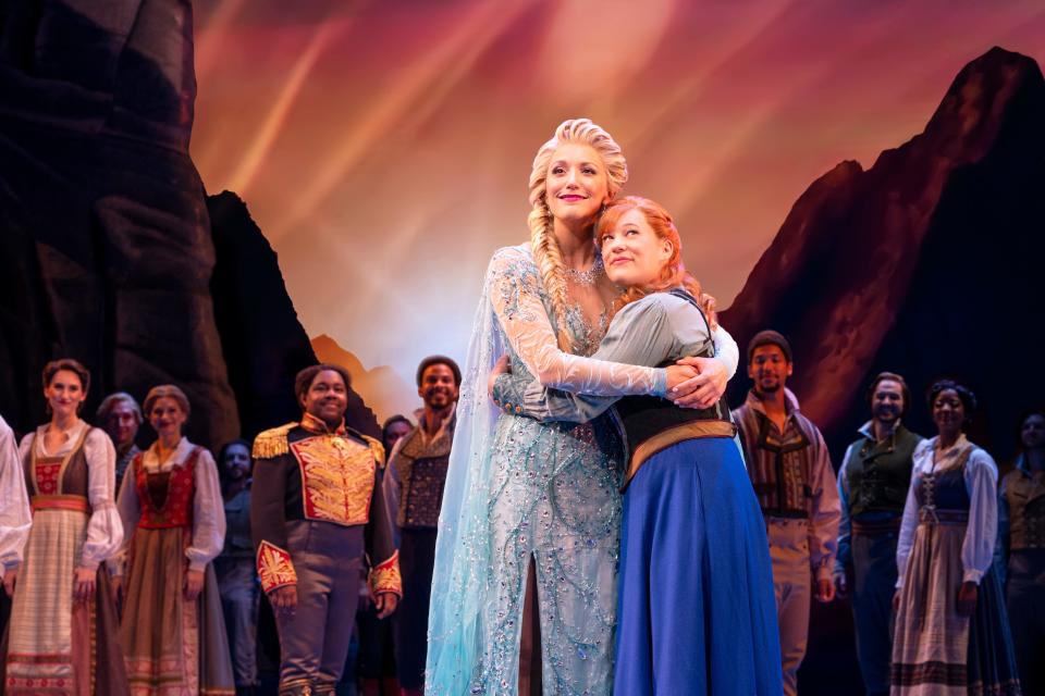 Caroline Bowman (as Elsa), left, and Lauren Nicole Chapman (as Anna) with company in national tour of “Frozen.”