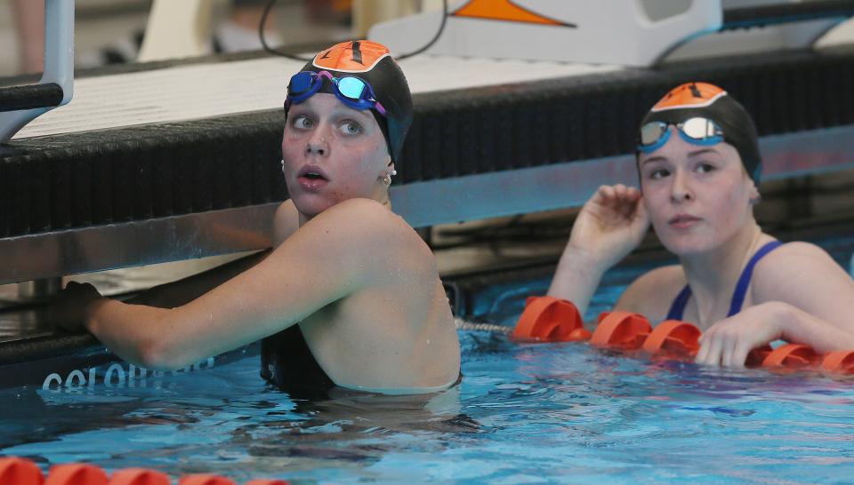 Ames girls swimmers Andra Robertson (left) and Reese Winer, seen here at the IGHSAU regional swimming and diving meet at the Dan Flannery Pool in Ames on Nov. 4, both placed high in the 200-yard individual medley and 100 breaststroke at the girls state swimming and diving meet held Nov. 10-11 at the Marshalltown YMCA-YWCA.