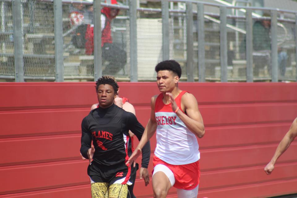 Shelby's Issaiah Ramsey and Mansfield Christian's Amarr Davis go at it in the 100 meters.