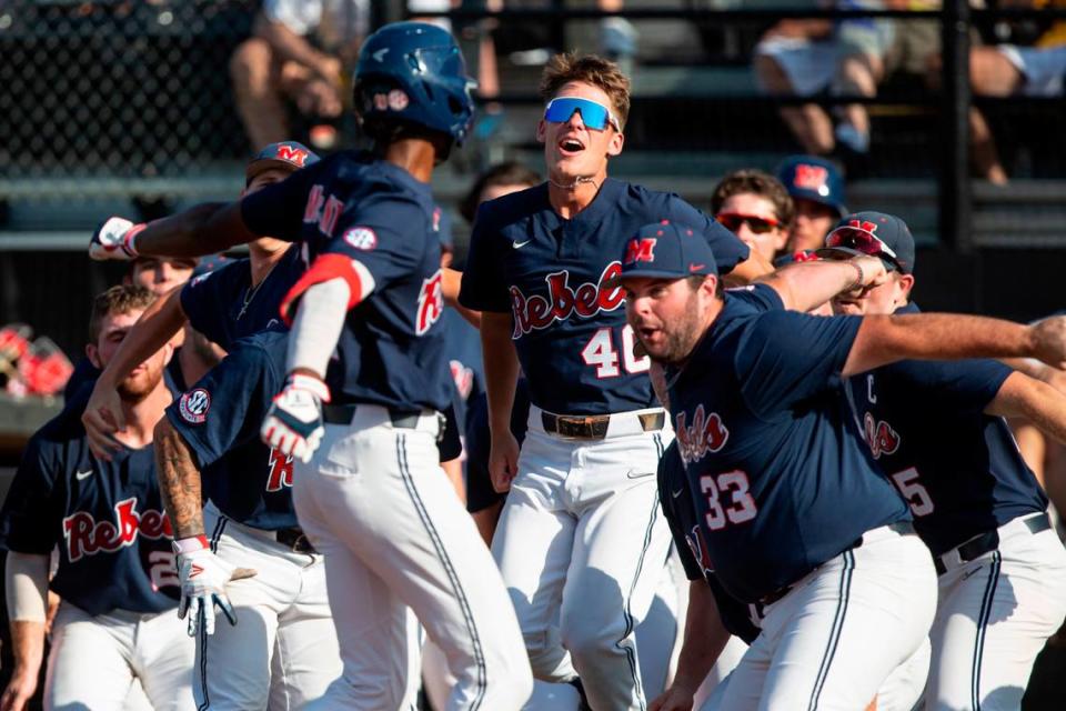 Ole Miss celebrates as TJ McCants scores a home run during the 8th inning of the Super Regionals finals at Pete Taylor Park on Sunday, June 12, 2022.