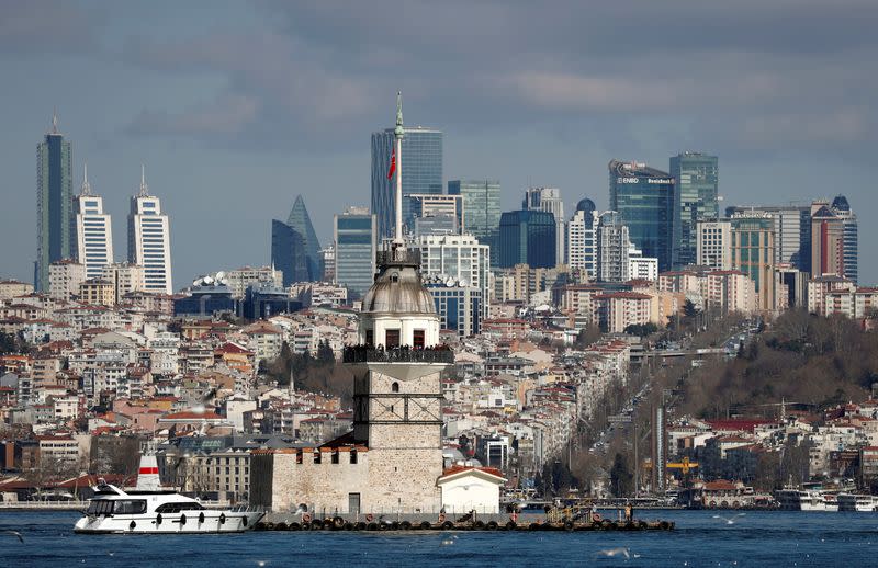 FILE PHOTO: Maiden's Tower, an islet on the Bosphorus, is pictured with the city's skyscrapers in the background in Istanbul