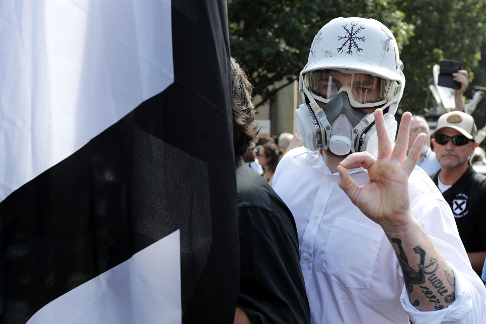 <p>Hundreds of white nationalists, neo-Nazis and members of the “alt-right” march down East Market Street toward Lee Park during the “Unite the Right” rally Aug.12, 2017 in Charlottesville, Va. (Photo: Chip Somodevilla/Getty Images) </p>