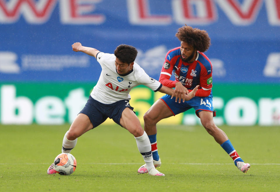 Tottenham forward Son Heung-min (left) holds off Crystal Palace's Jairo Riedewald during their Premier League match at Selhurst Park In July.