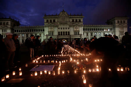A vigil for victims after a fire broke out at the Virgen de Asuncion home in San Jose Pinula, on the outskirts of Guatemala City, March 9, 2017. REUTERS/Saul Martinez