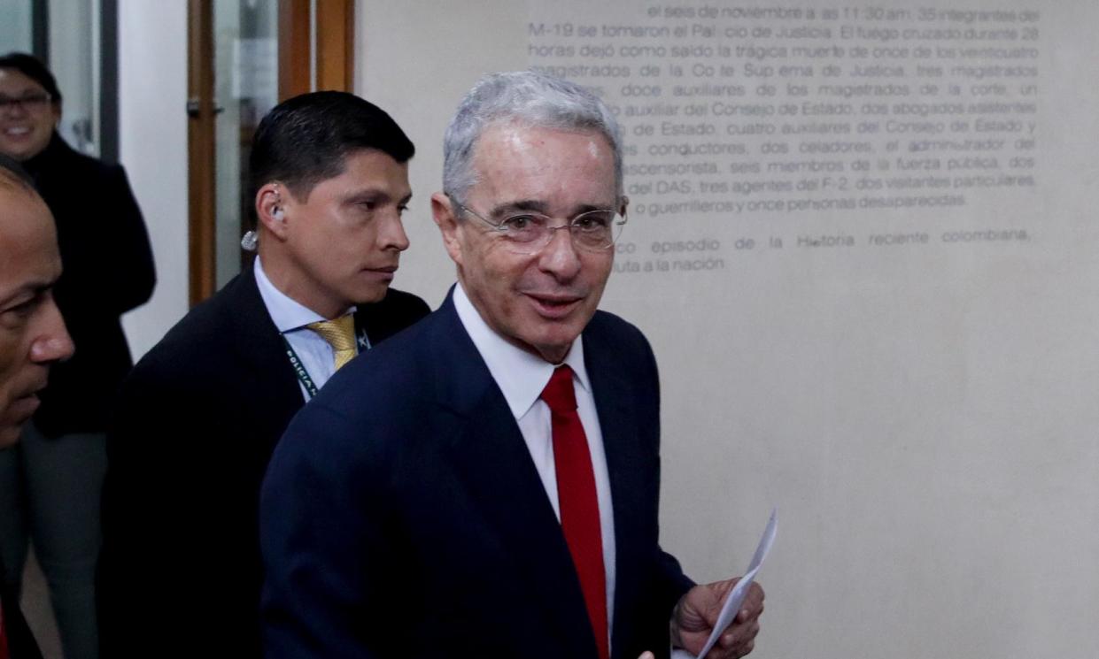 <span>Álvaro Uribe at Colombia’s supreme court for questioning in an investigation for witness tampering charges in Bogota, Colombia, on 8 October 2019.</span><span>Photograph: Iván Valencia/AP</span>