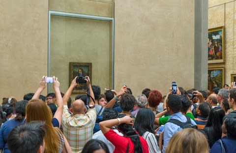 The Mona Lisa on display at the Louvre