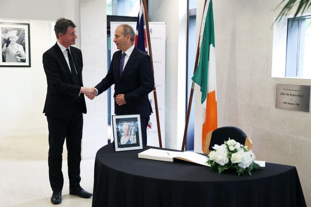 Mr Martin with Paul Johnston, British Ambassador to Ireland, after signing a book of condolences for the Queen in the British Embassy in Dublin