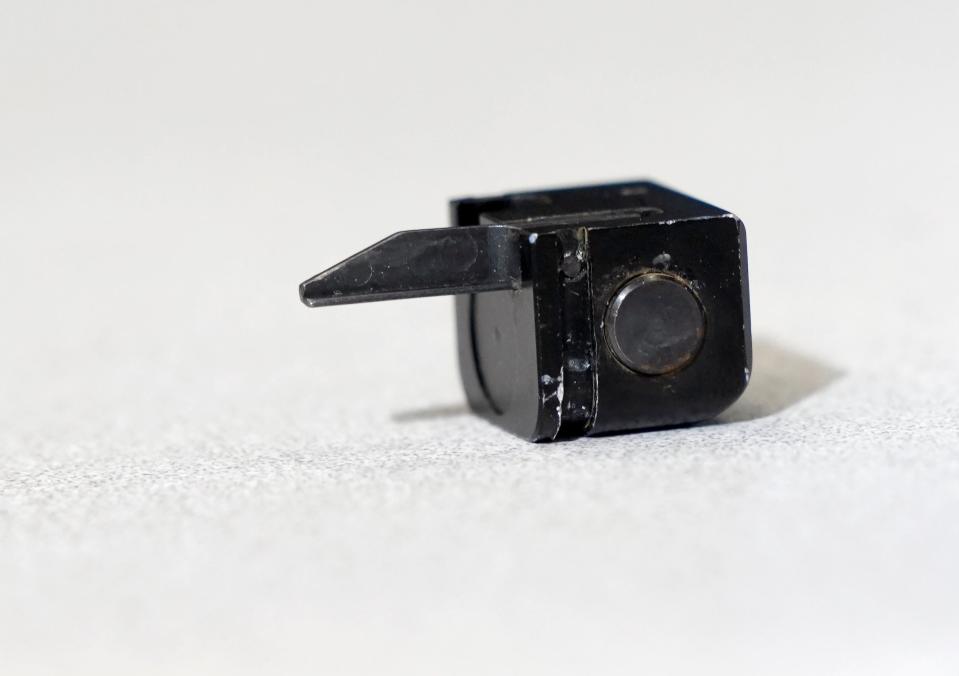 April 28, 2023; Columbus, Ohio, USA;  
A "Glock switch," is seen during a press conference at the Columbus Police Academy on Friday. The small device can be attached to the rear of the slide of a Glock handgun, converting the semi-automatic pistol into a machine pistol capable of fully automatic fire.
Mandatory Credit: Barbara J. Perenic/Columbus Dispatch