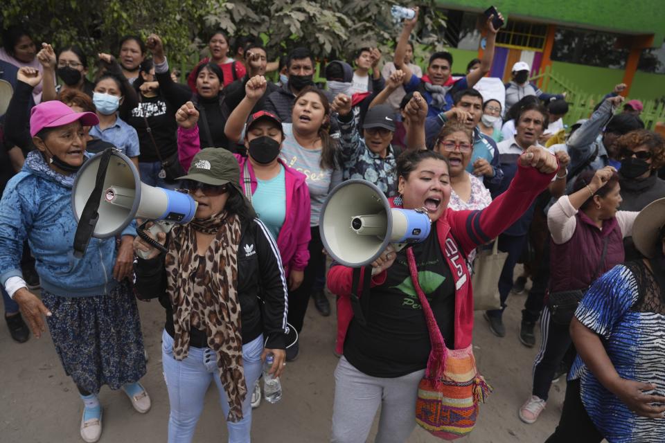 Supporters of former President Pedro Castillo gather outside the police base where former President Pedro Castillo is held following his arrest and faces charges of rebellion on the outskirts of Lima, Peru, Thursday, Dec. 8, 2022. Peru’s Congress voted to remove Castillo from office Wednesday and replace him with the vice president, shortly after Castillo tried to dissolve the legislature ahead of a scheduled vote to remove him. (AP Photo/Guadalupe Pardo)