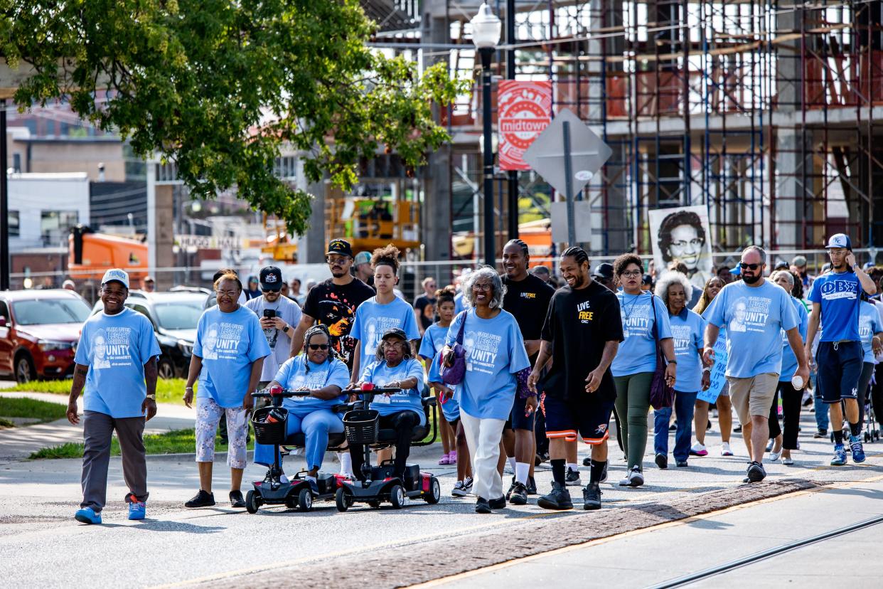 A group marches Saturday from Frontline Church to Kaiser's Grateful Bean for a reenactment of a sit-in commemorating the 65th anniversary of the Oklahoma City civil rights movement hosted by the Clara Luper Legacy Committee in Oklahoma City.