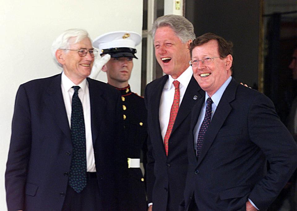 Former US President Bill Clinton, second from right, jokes with Seamus Mallon and David Trimble when they visited the White House in Washington (Paul Faith/PA) (PA Archive)