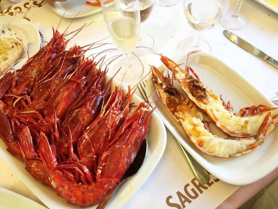 Two plates of prawns at a restaurant