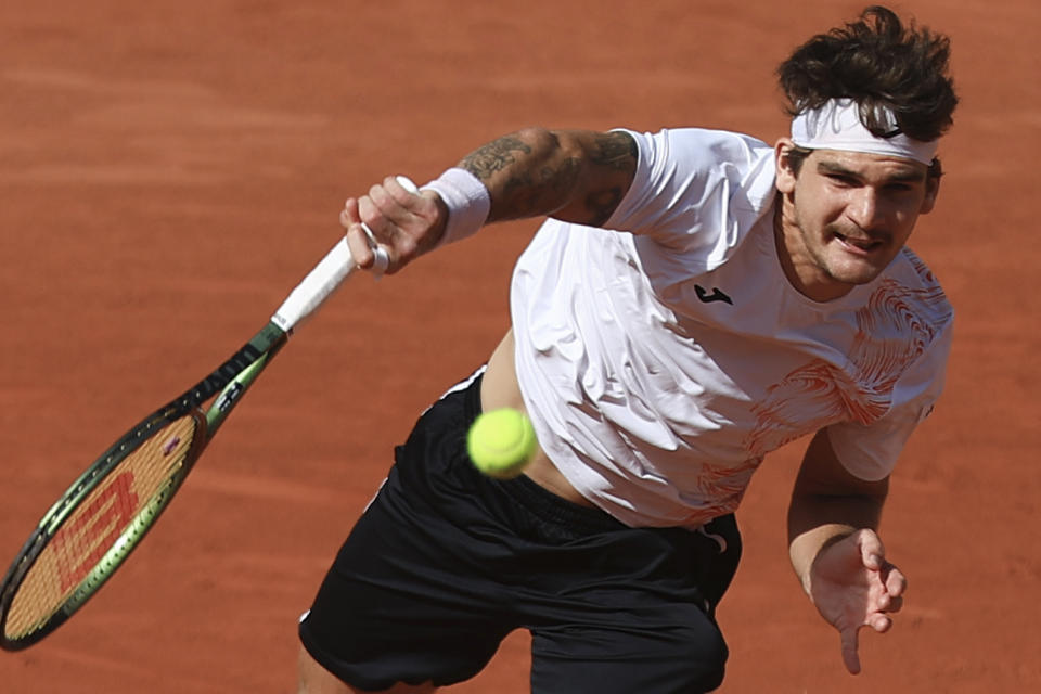 Brazil's Thiago Seyboth Wild serves against Russia's Daniil Medvedev during their first round match of the French Open tennis tournament at the Roland Garros stadium in Paris, Tuesday, May 30, 2023. (AP Photo/Aurelien Morissard)