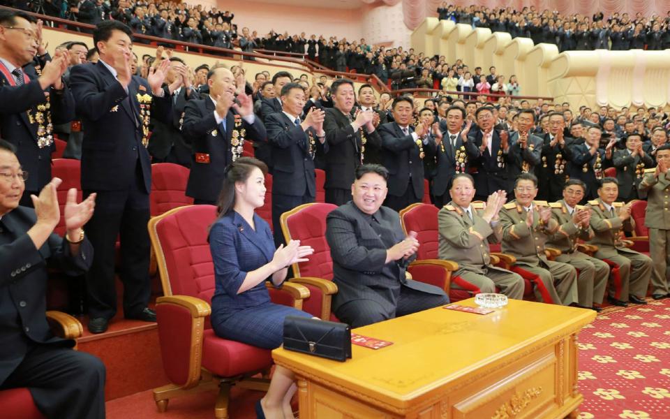 Kim Jong-un and his wife Ri Sol-ju attending the gala - AFP
