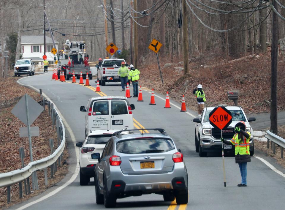 A utility crew has one lane of Hardscrabble Road in North Salem blocked as they repair damaged wires and utility poles after an overnight rain and wind storm caused damage in the area Feb. 29, 2024.