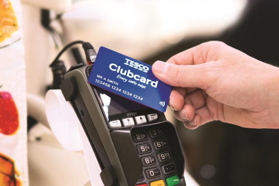 Tesco said its Clubcard points will now be worth twice their value when customers cash them in, rather than three times (PA) (PA Media)
