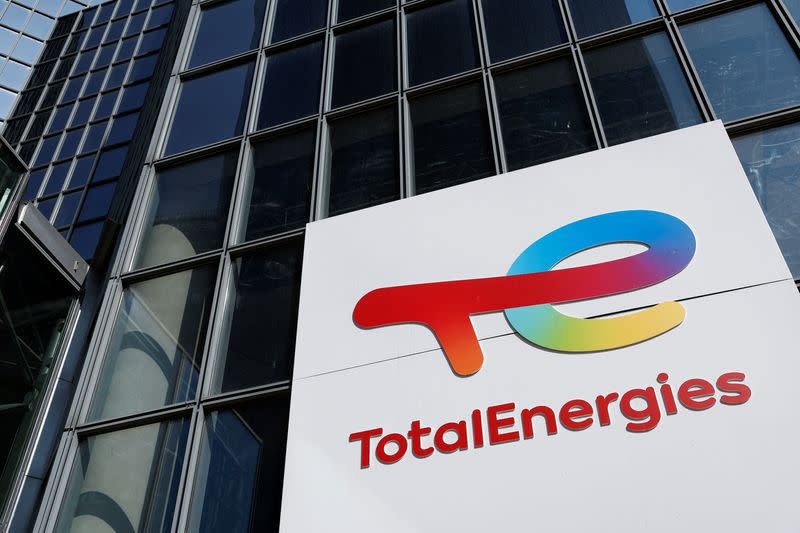 The TotalEnergies logo sits on the company's headquarter skyscraper in the La Defense business district in Paris