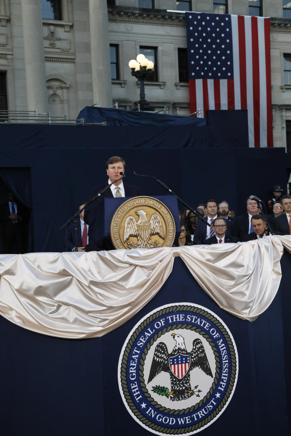 Gov. Tate Reeves addresses a joint session of the Legislature outside the Capitol as he delivers his first State of the State address in Jackson, Miss., Monday, Jan. 27, 2020. (AP Photo/Rogelio V. Solis)