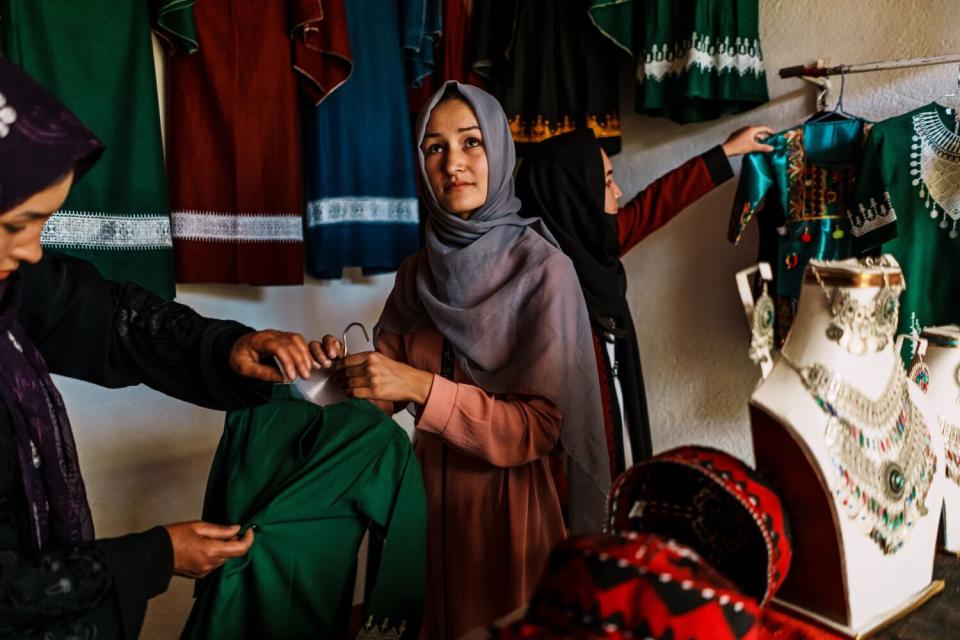 Meena Ibrahimi, her mother and sister all wear scarves over their hair but do not cover their faces.