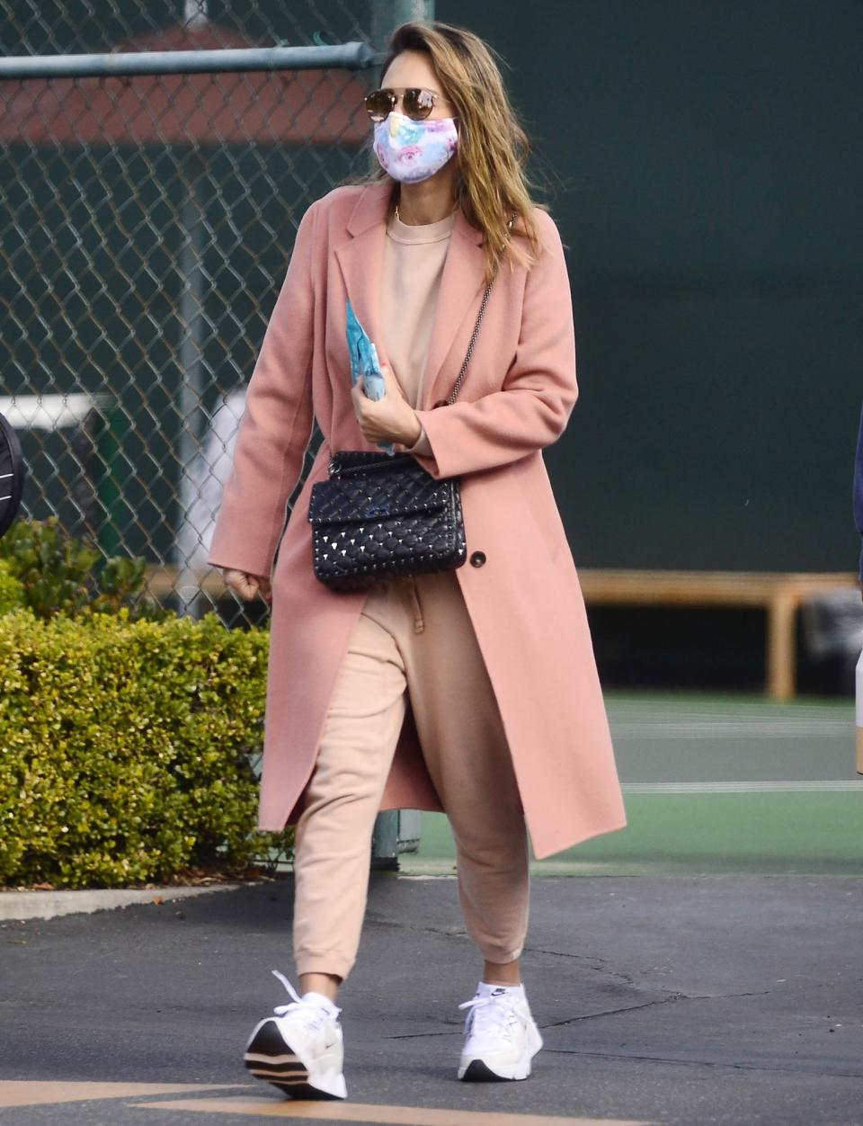 <p>Jessica Alba leaves a tennis lesson in a blush pink sweatsuit on Sunday in L.A. </p>