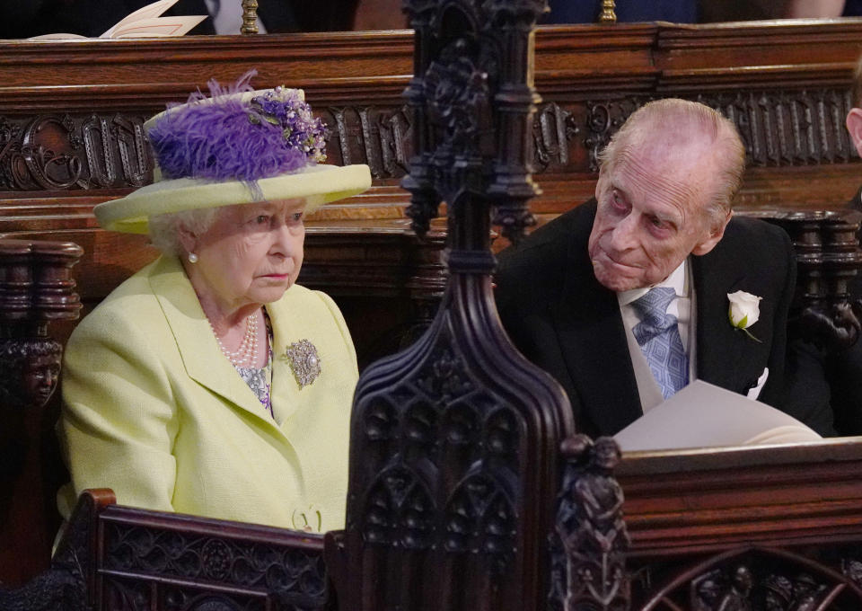 Britain's Queen Elizabeth II and Britain's Prince Philip, Duke of Edinburgh (R) during the wedding ceremony of Britain's Prince Harry, Duke of Sussex and US actress Meghan Markle in St George's Chapel, Windsor Castle, in Windsor, on May 19, 2018. 