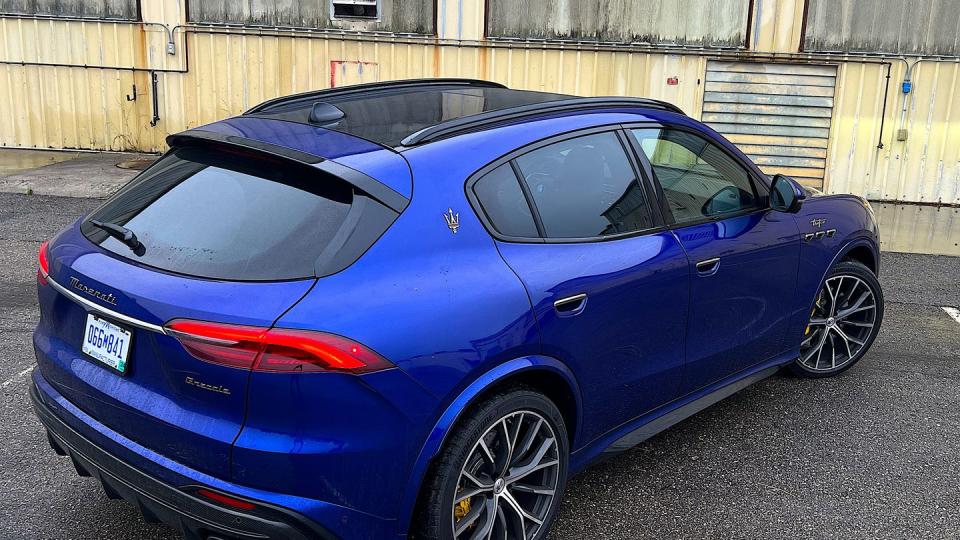 a blue car parked in a driveway