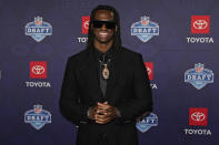 Ohio State wide receiver Marvin Harrison Jr. poses on the red carpet ahead of the first round of the NFL football draft, Thursday, April 25, 2024, in Detroit. (AP Photo/Carlos Osorio)