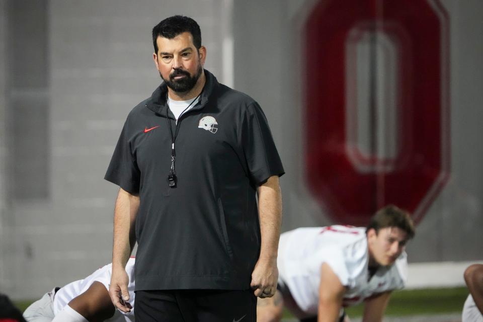 Mar 7, 2024; Columbus, OH, USA; Ohio State Buckeyes head coach Ryan Day watches players stretch during spring football practice at the Woody Hayes Athletic Center.