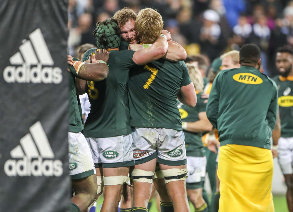 South Africa's players celebrate their win in a rugby championship test match between South Africa and New Zealand in Wellington, New Zealand, Saturday, Sept. 15, 2018. (AP Photo/John Cowpland)
