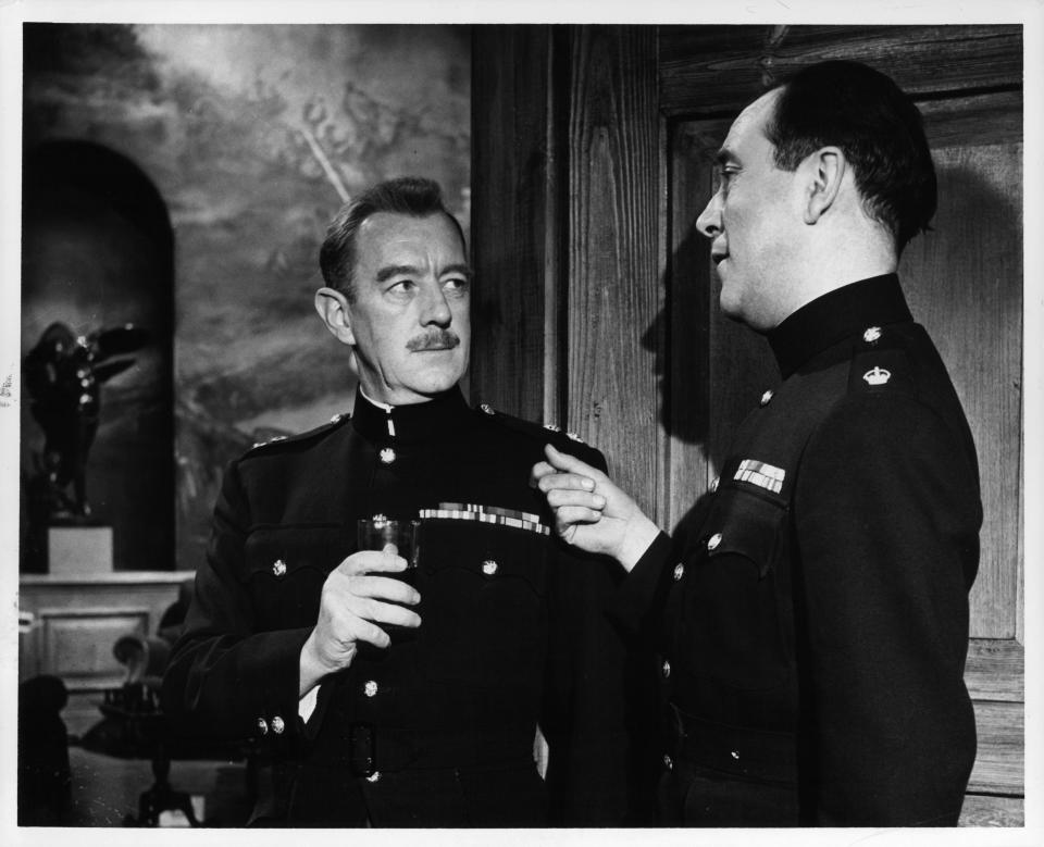 Alec Guinness listens as Dennis Price talks to him in a scene from the film 'Tunes Of Glory', 1960. (Photo by United Artists/Getty Images)